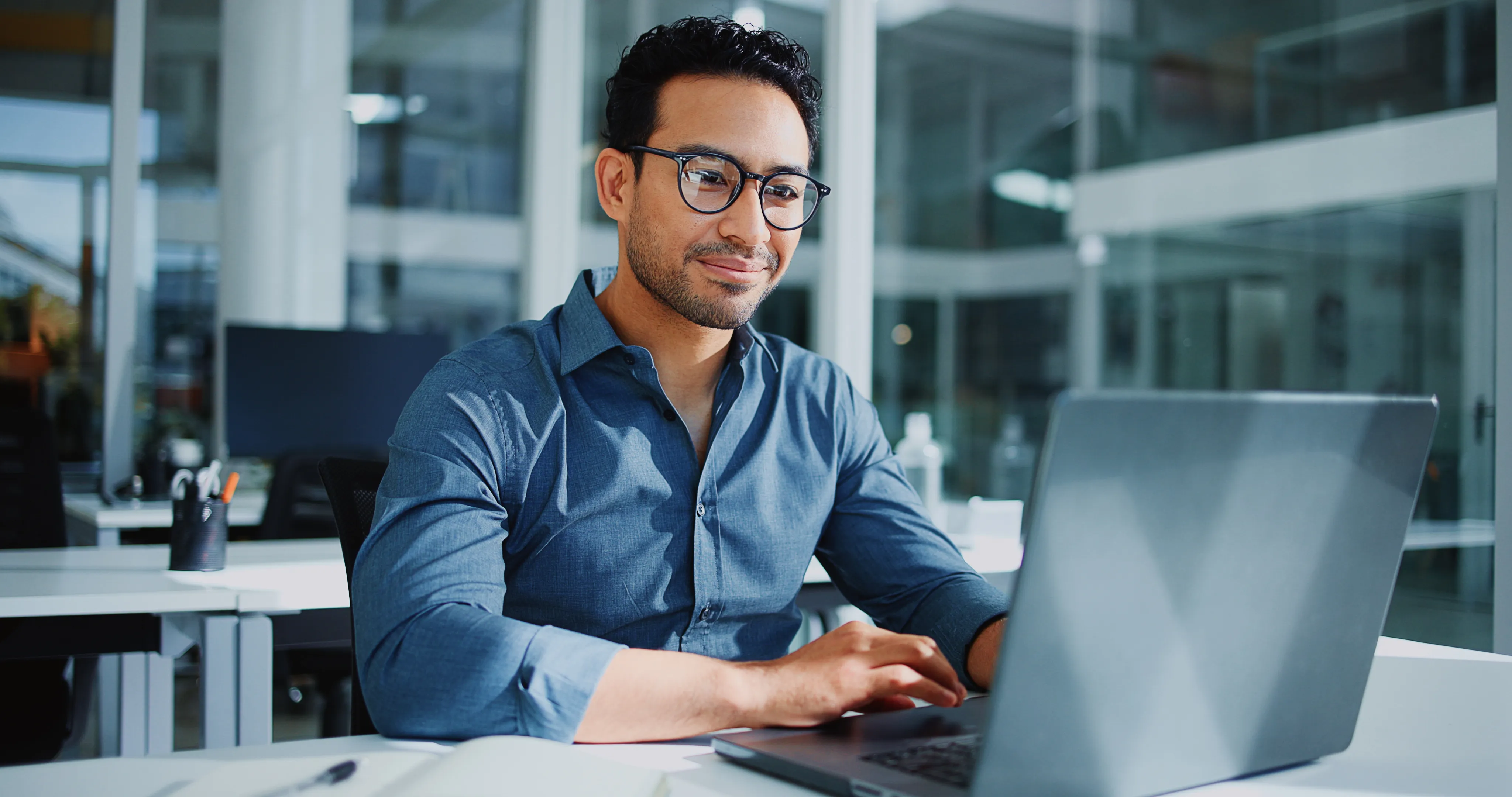 Professional reviewing AI workflows on a laptop